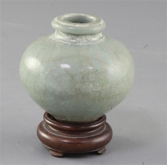 A Chinese Longquan celadon ovoid jar, Song - Yuan dynasty, 7.5cm, wood stand